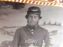 Civil War soldier standing in front of interesting backdrop tintype photograph
