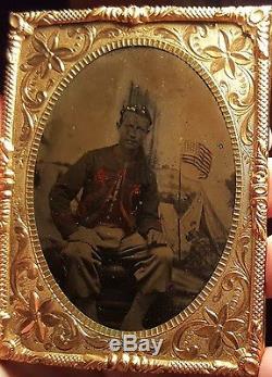 Civil war tintype quarter plate of Union zouave soldier dark image with tinting