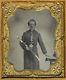 EXCEPTIONAL CIVIL WAR SOLDIER PRESENTING GOLD TINTED SWORD CASED TINTYPE