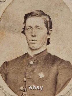 Oval CDV bust view of a Union soldier wearing 6th Corps badge